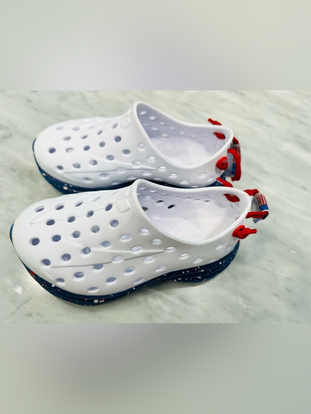 Kids White Slip-On Water Shoes with Navy Speckled Sole and Red Pull Tab